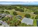 Aerial view outlining the property lines surrounded by lush greenery and nearby lake views at 189 Blackstone Creek Rd, Groveland, FL 34736