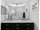 Stylish bathroom featuring double sinks, marble countertop, and elegant lighting at 189 Blackstone Creek Rd, Groveland, FL 34736