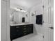 Stylish bathroom featuring double sinks, marble countertop, and elegant lighting at 189 Blackstone Creek Rd, Groveland, FL 34736
