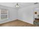 Bright bedroom boasts a ceiling fan and light wood flooring at 189 Blackstone Creek Rd, Groveland, FL 34736