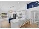 Bright, updated kitchen with stainless steel appliances and a center island with seating at 189 Blackstone Creek Rd, Groveland, FL 34736