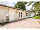 House exterior shows a brick patio and doors leading to a spacious backyard at 1891 Bryan Ave, Winter Park, FL 32789