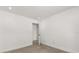 Clean, minimalist bedroom featuring wood-look flooring and an open doorway, enhancing the sense of space and flow at 1891 Bryan Ave, Winter Park, FL 32789