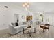 Open-concept living room blending seamlessly with dining area and kitchen, featuring modern decor and ample natural light at 1891 Bryan Ave, Winter Park, FL 32789