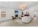Bright living room with a fireplace, modern furnishings, neutral color palette, and wood-look tile floors at 1891 Bryan Ave, Winter Park, FL 32789