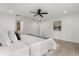 Inviting main bedroom featuring a ceiling fan, wood-look flooring, and a glimpse into the ensuite bathroom at 1891 Bryan Ave, Winter Park, FL 32789