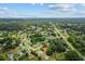 Aerial view of neighborhood, showcasing the property's location among surrounding homes and streets at 19 Hemlock Terrace Way, Ocala, FL 34472
