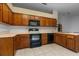 Functional kitchen with wood cabinets, modern appliances, and ample counter space at 19 Hemlock Terrace Way, Ocala, FL 34472