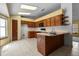 Cozy kitchen featuring wooden cabinets, essential appliances, and an open layout at 19 Hemlock Terrace Way, Ocala, FL 34472