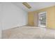 A living room features tile floors and sliding glass doors leading to outdoor area at 19 Hemlock Terrace Way, Ocala, FL 34472