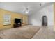 Spacious living room featuring tile flooring, neutral walls, and a ceiling fan at 19 Hemlock Terrace Way, Ocala, FL 34472