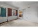 View of a bare living space with textured walls and doors leading to other rooms at 19 Hemlock Terrace Way, Ocala, FL 34472