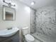 Bathroom featuring a modern vanity, toilet, and beautifully tiled walk-in shower at 2109 Hartwell Ave, Sanford, FL 32771