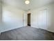 This carpeted bedroom features a closet and white trim at 2109 Hartwell Ave, Sanford, FL 32771