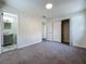 Bedroom with gray carpet, ensuite bathroom, and double door closet provide ample space and convenience at 2109 Hartwell Ave, Sanford, FL 32771