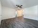 Bright living room with ceiling fan and new flooring, with an open layout at 2109 Hartwell Ave, Sanford, FL 32771