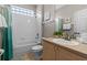 Clean bathroom with a tub-shower combo, a single sink vanity and decorative accents at 2222 Wyndham Palms Way, Kissimmee, FL 34747
