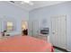 Cozy bedroom featuring a ceiling fan, neutral walls, and a comfortable bed with pastel bedding at 2222 Wyndham Palms Way, Kissimmee, FL 34747