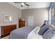 Comfortable bedroom with a large bed, ceiling fan, and stylish decor at 2222 Wyndham Palms Way, Kissimmee, FL 34747