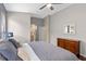 Comfortable bedroom with ensuite bathroom, a large bed, and stylish decor at 2222 Wyndham Palms Way, Kissimmee, FL 34747