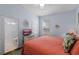 Comfortable bedroom with an ensuite bathroom, tv, and a large bed with tropical-themed pillows at 2222 Wyndham Palms Way, Kissimmee, FL 34747