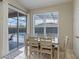 Dining area with backyard pool view, features tile flooring and lots of natural light at 2222 Wyndham Palms Way, Kissimmee, FL 34747