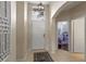 Inviting foyer with tile flooring, high ceilings, and natural light, leading to an open floor plan at 2222 Wyndham Palms Way, Kissimmee, FL 34747
