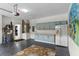 Two-car garage with blue cabinetry, epoxy floors, water heater, and refrigerator at 2222 Wyndham Palms Way, Kissimmee, FL 34747