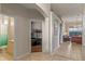 Spacious hallway with arched doorways, tile flooring, and views of the living area and bedrooms at 2222 Wyndham Palms Way, Kissimmee, FL 34747