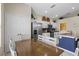 Well-lit kitchen with stainless steel appliances, center island and eat-in dining area at 2222 Wyndham Palms Way, Kissimmee, FL 34747