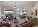 Spacious living area with large sliding doors, an open layout, and modern decor at 2222 Wyndham Palms Way, Kissimmee, FL 34747