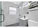 Modern bathroom featuring a glass walk-in shower, updated vanity, and sleek fixtures at 224 Woodmere Blvd, Sanford, FL 32773