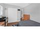 Neutral bedroom with wood flooring, a large closet, and a dresser in the corner at 224 Woodmere Blvd, Sanford, FL 32773