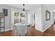 Bright dining area with a modern round table, comfortable seating, and sliding glass doors at 224 Woodmere Blvd, Sanford, FL 32773