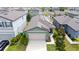 An aerial view of a single-Gathering home featuring solar panels and a well-manicured lawn at 2249 Litchfield Loop, Deland, FL 32720
