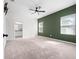 Large bedroom with neutral carpet, ceiling fan, and view into ensuite bathroom at 2249 Litchfield Loop, Deland, FL 32720