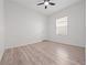 Bright bedroom with wood-look floors and natural lighting at 2249 Litchfield Loop, Deland, FL 32720