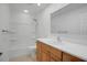 Bathroom featuring a shower-tub combination, wood cabinets, a modern mirror, and tile floors at 2250 Blossomwood Dr, Oviedo, FL 32765