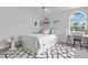 Bright bedroom featuring a full sized bed, a patterned rug, a window, and a desk at 2250 Blossomwood Dr, Oviedo, FL 32765