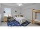 Comfortable bedroom with a desk, a bunk bed, a closet with louvered doors, and a patterned rug at 2250 Blossomwood Dr, Oviedo, FL 32765