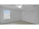 Well-lit bedroom with a ceiling fan, window with blinds, and closet at 2250 Blossomwood Dr, Oviedo, FL 32765