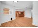Open-concept space showcasing hardwood floors and leading to a kitchen with a large island at 2250 Blossomwood Dr, Oviedo, FL 32765