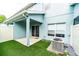 This fenced yard has artificial turf and a covered patio with access to the home at 2337 Bexley Pl, Casselberry, FL 32707