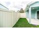 The fenced backyard features low-maintenance artificial grass and a private outdoor area at 2337 Bexley Pl, Casselberry, FL 32707