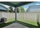 Enclosed backyard with artificial turf and a concrete patio at 2337 Bexley Pl, Casselberry, FL 32707