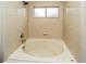 A cozy bathroom with a built in tub and shower at 2337 Bexley Pl, Casselberry, FL 32707