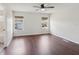 Bright bedroom with wood floors, ceiling fan, and natural light from two windows at 2337 Bexley Pl, Casselberry, FL 32707