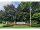 The Devon Place community sign is surrounded by lush landscaping and mature trees, creating a welcoming entrance at 2337 Bexley Pl, Casselberry, FL 32707