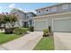 Charming townhome with a two-car garage, a well-manicured lawn, and curb appeal at 2337 Bexley Pl, Casselberry, FL 32707