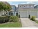 Charming townhome with a two-car garage, a well-manicured lawn, and curb appeal at 2337 Bexley Pl, Casselberry, FL 32707